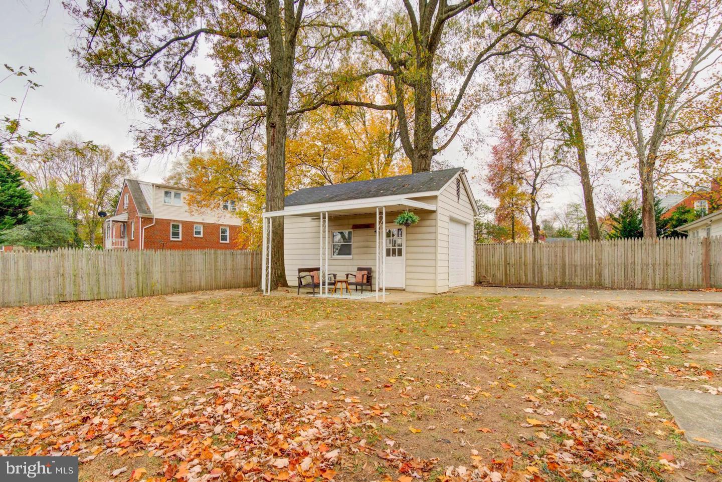 11207 Emack Road Beltsville, MD 20705 - Photo 40 of 43 Charming shed amid autumn leaves.