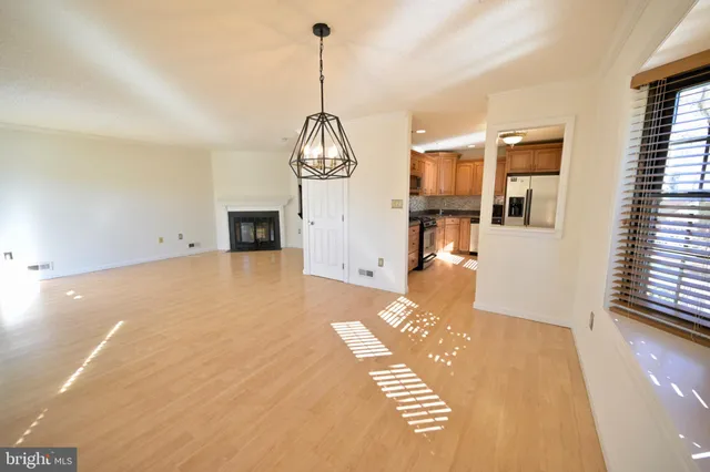 a view of a living room and kitchen with furniture