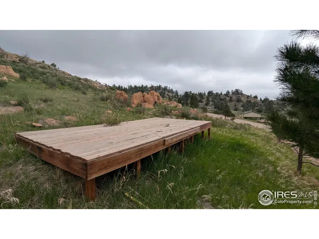 a balcony with a table and chairs