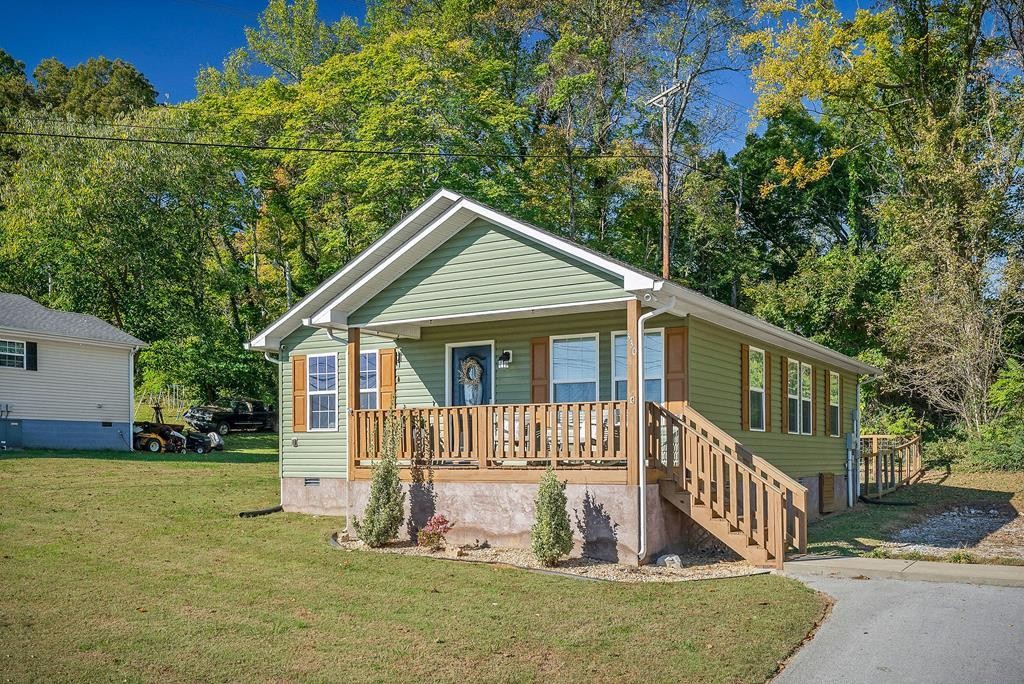 330 Flatt Street Sparta, TN 38583 - Photo 2 of 24 a view of a house with a yard and fence