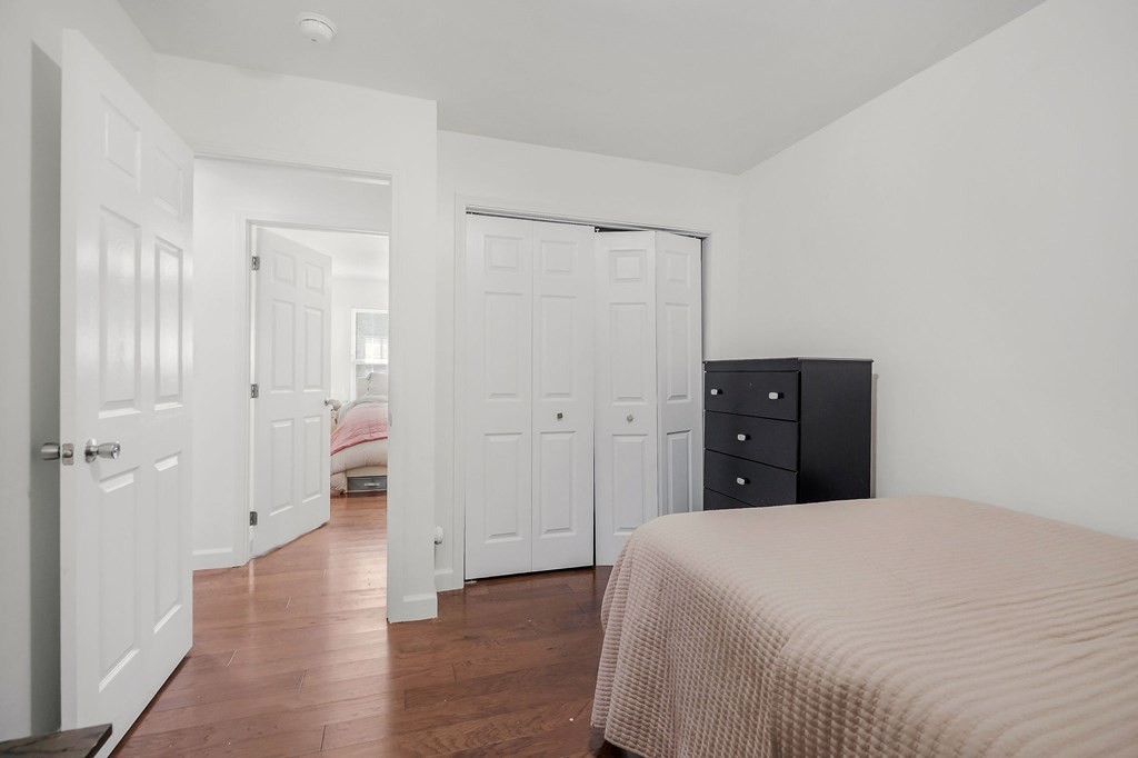 330 Flatt Street Sparta, TN 38583 - Photo 21 of 24 a spacious bedroom with a bed and wooden floor