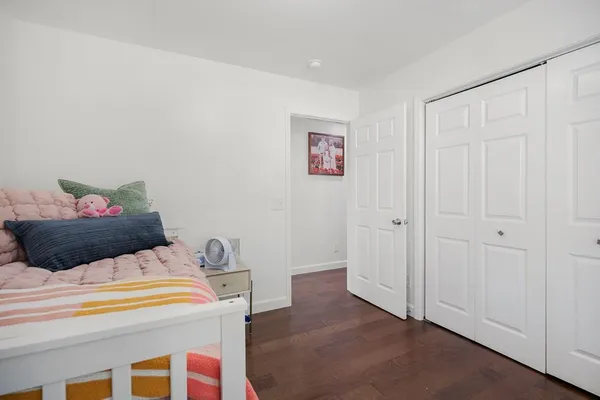 a bedroom with a bed and a cabinets