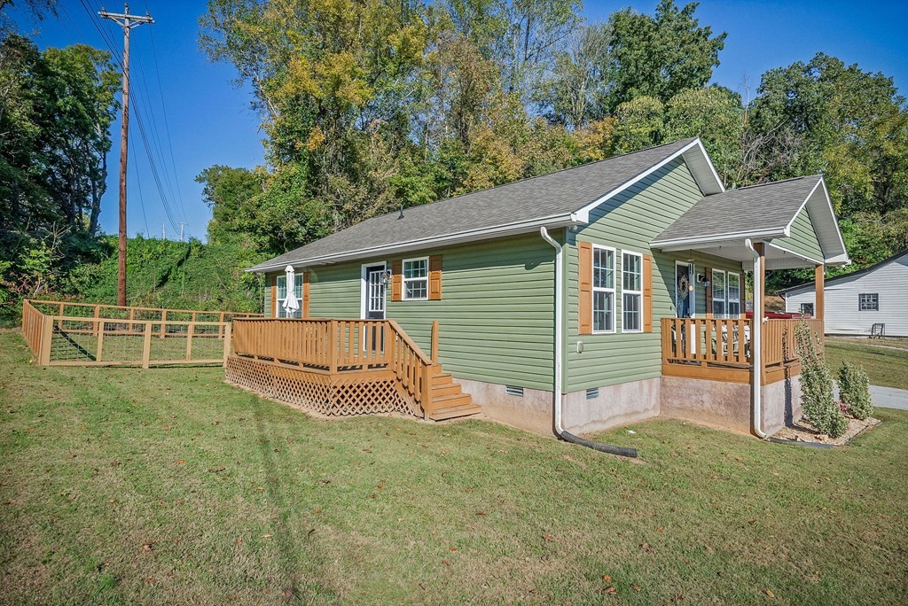 330 Flatt Street Sparta, TN 38583 - Photo 4 of 24 a view of a house with a yard and deck