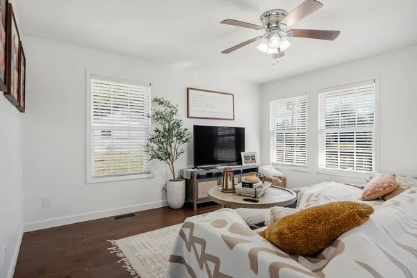 a bedroom with two beds and a window