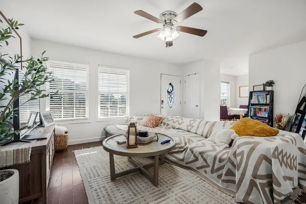 a view of a livingroom with furniture and a table