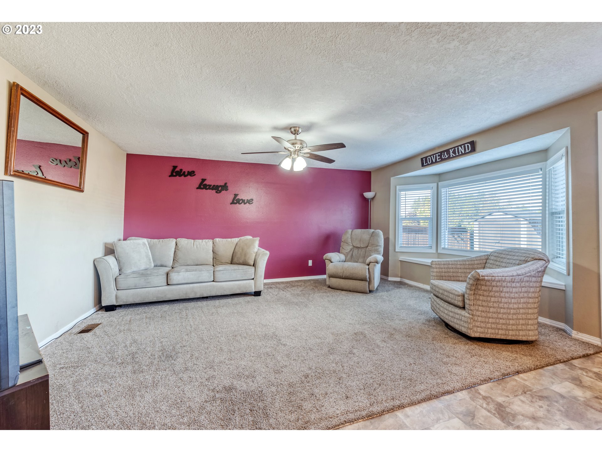 7370 B Street Springfield, OR 97478 - Photo 16 of 41 a living room with furniture and a large window