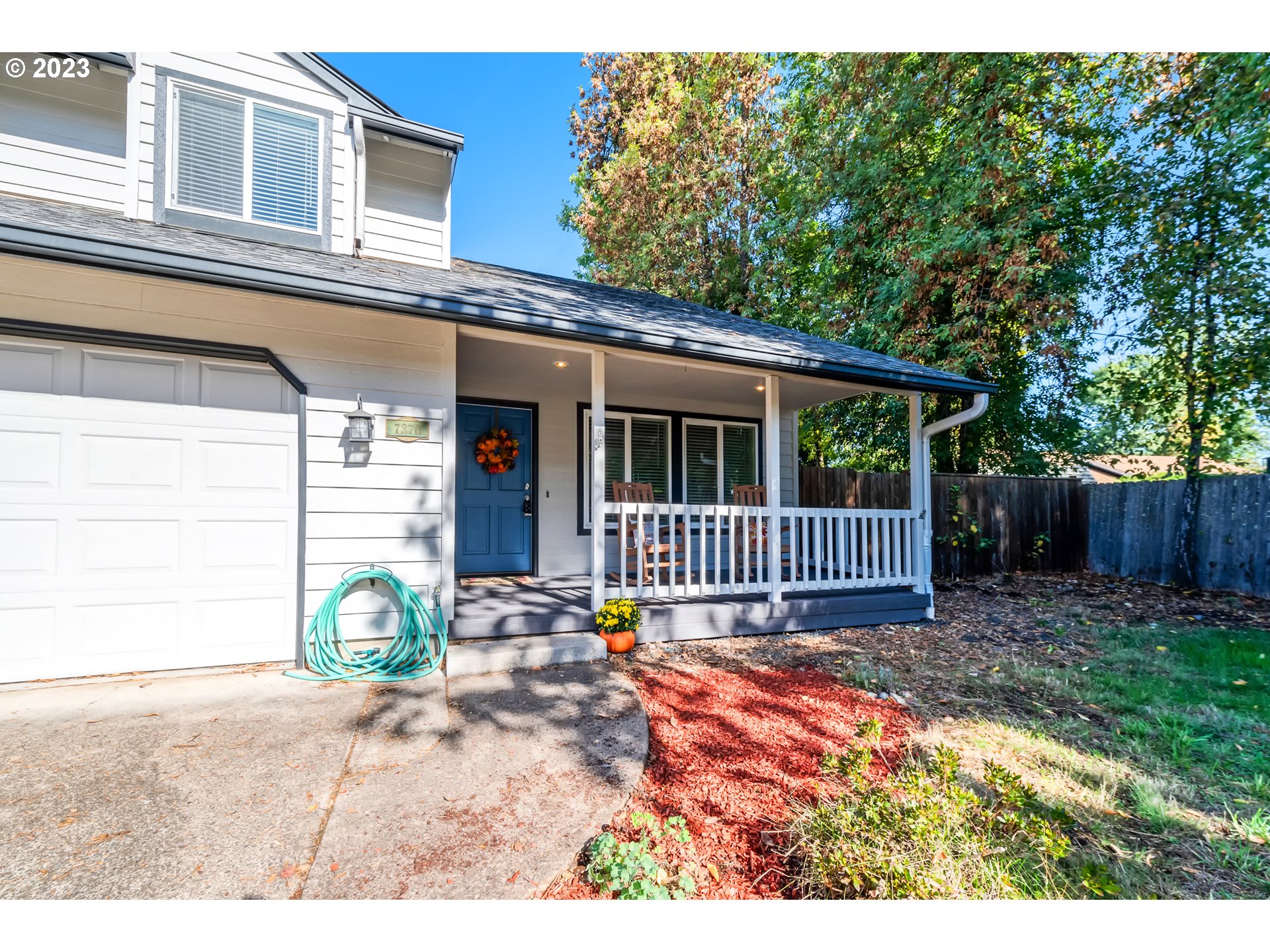 7370 B Street Springfield, OR 97478 - Photo 3 of 41 a view of a house with a porch and chair