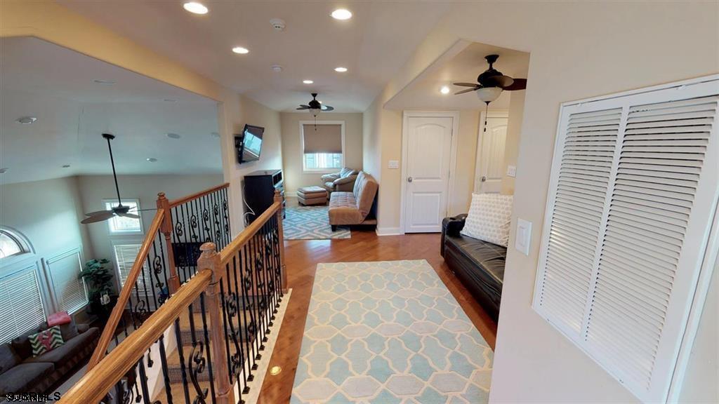 20 South Madison Avenue, Unit B Margate City, NJ 08402 - Photo 13 of 18 a hallway with furniture and stairs