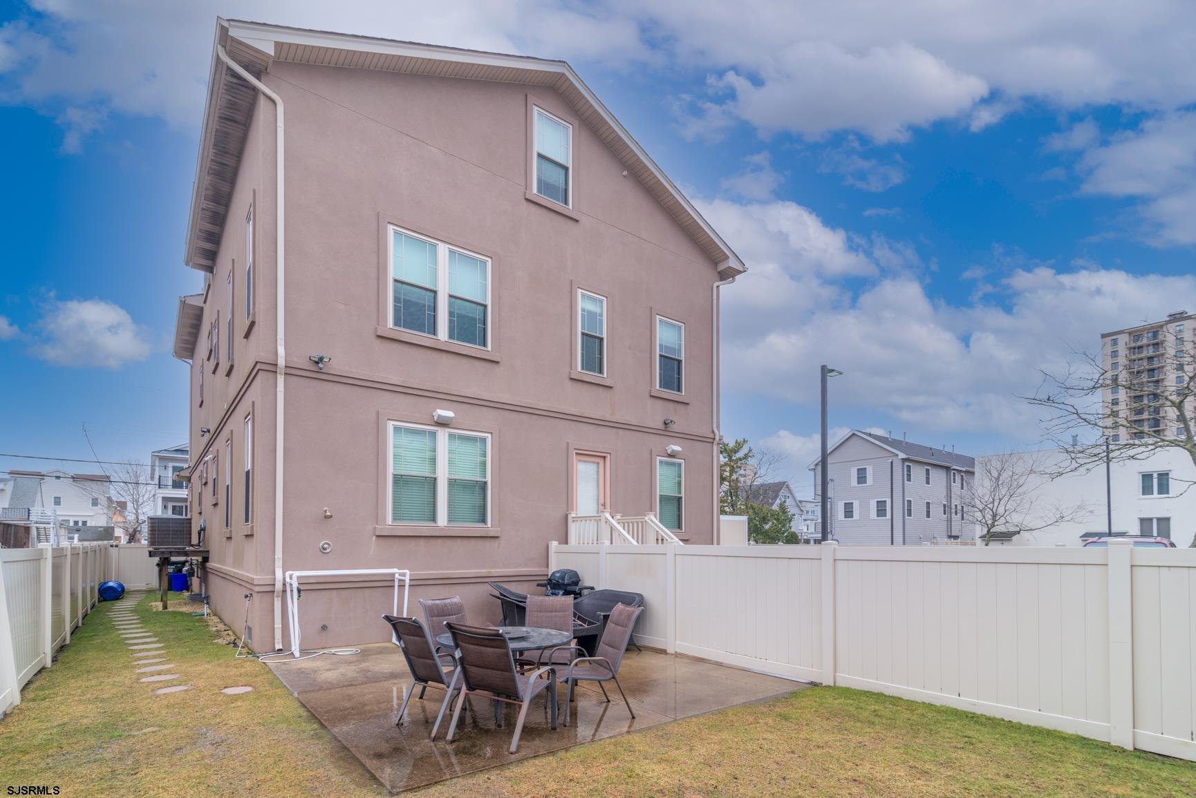 20 South Madison Avenue, Unit B Margate City, NJ 08402 - Photo 17 of 18 a view of a house with swimming pool and sitting area