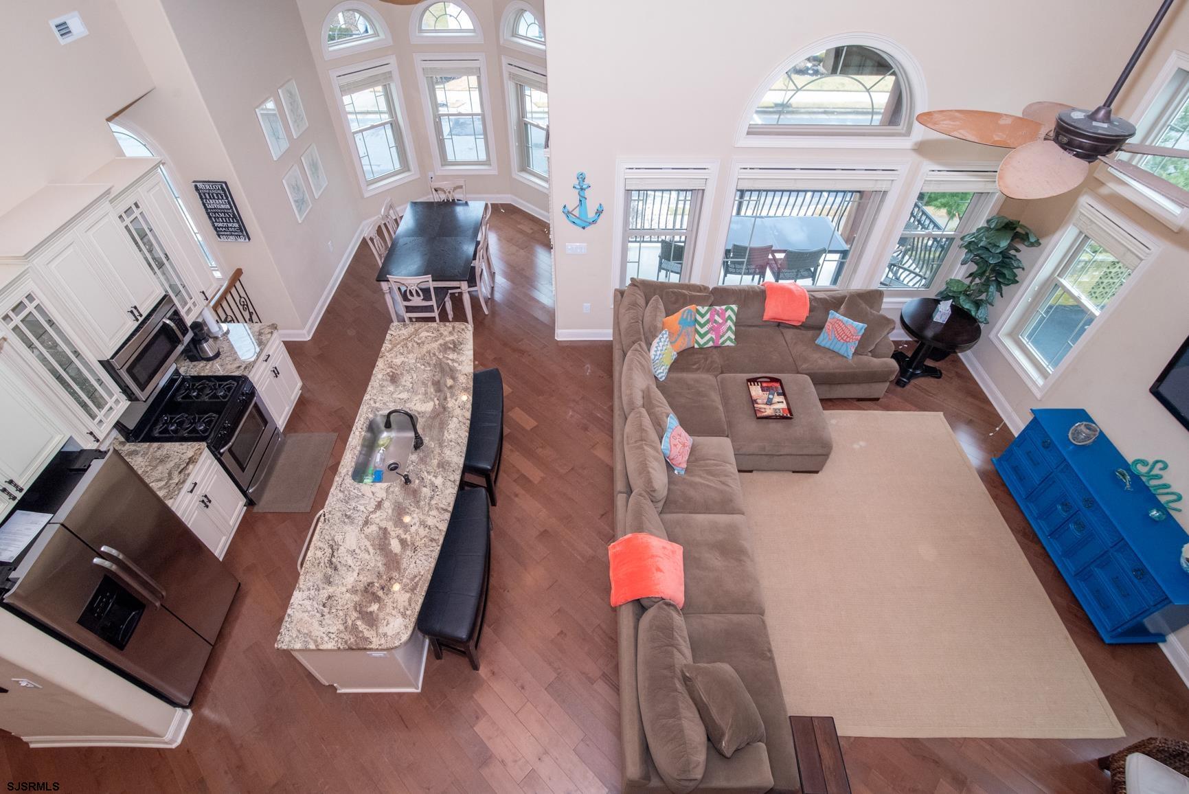 20 South Madison Avenue, Unit B Margate City, NJ 08402 - Photo 2 of 18 a living room with furniture and a fireplace