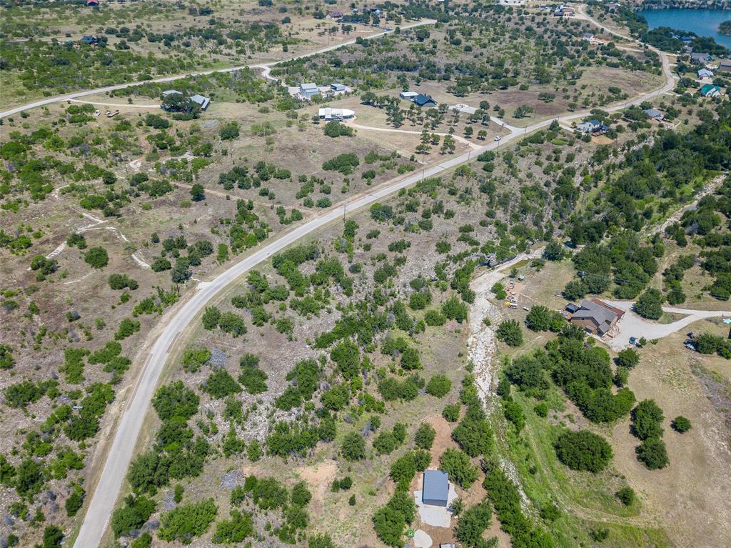 8021 Hells Gate Loop Strawn, TX 76475 - Photo 28 of 39 Drone / aerial view with a water view