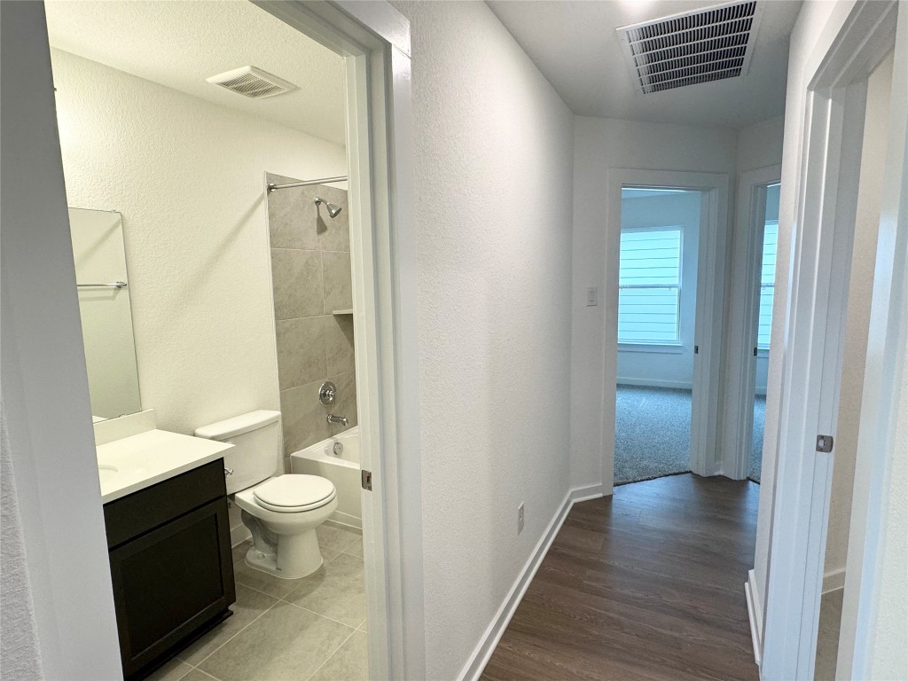212 Hazy Vw Road San Marcos, TX 78666 - Photo 11 of 20 a bathroom with a sink a toilet and shower