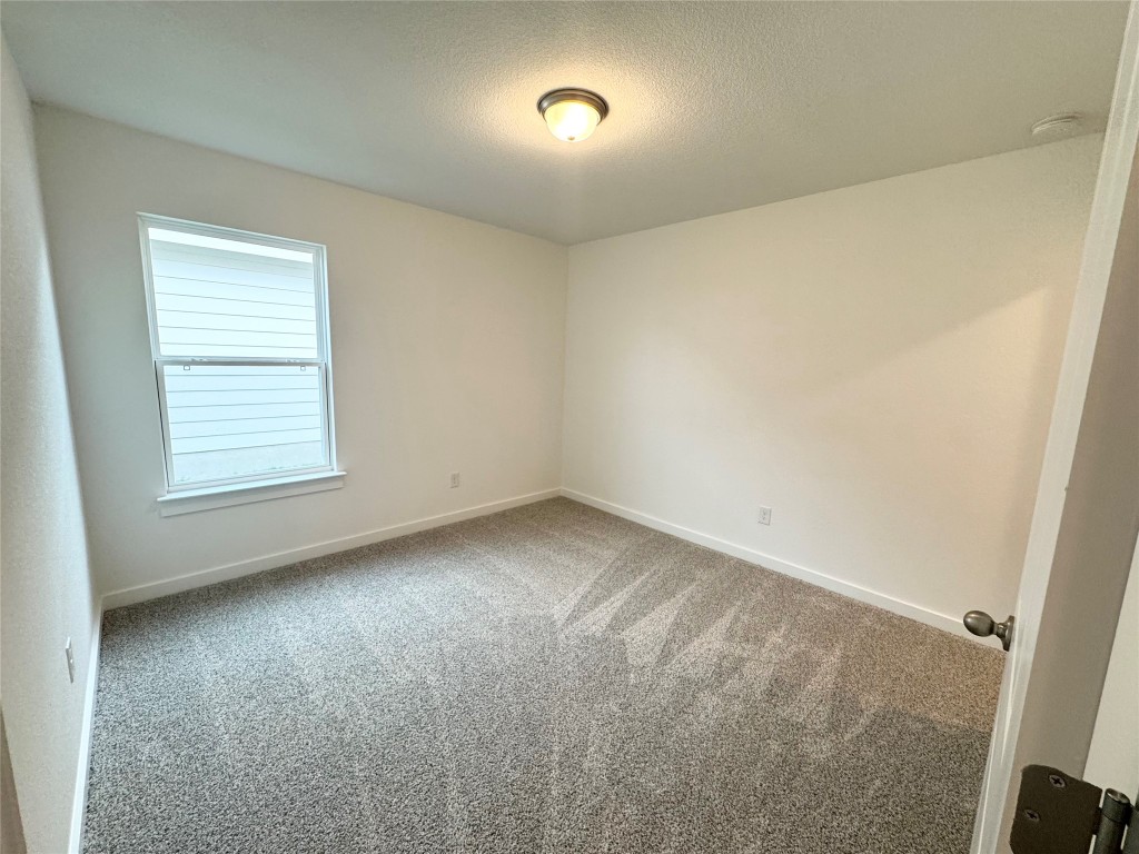 212 Hazy Vw Road San Marcos, TX 78666 - Photo 15 of 20 an empty room with a window