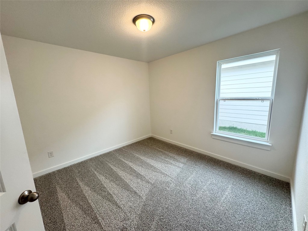 212 Hazy Vw Road San Marcos, TX 78666 - Photo 16 of 20 an empty room with a window