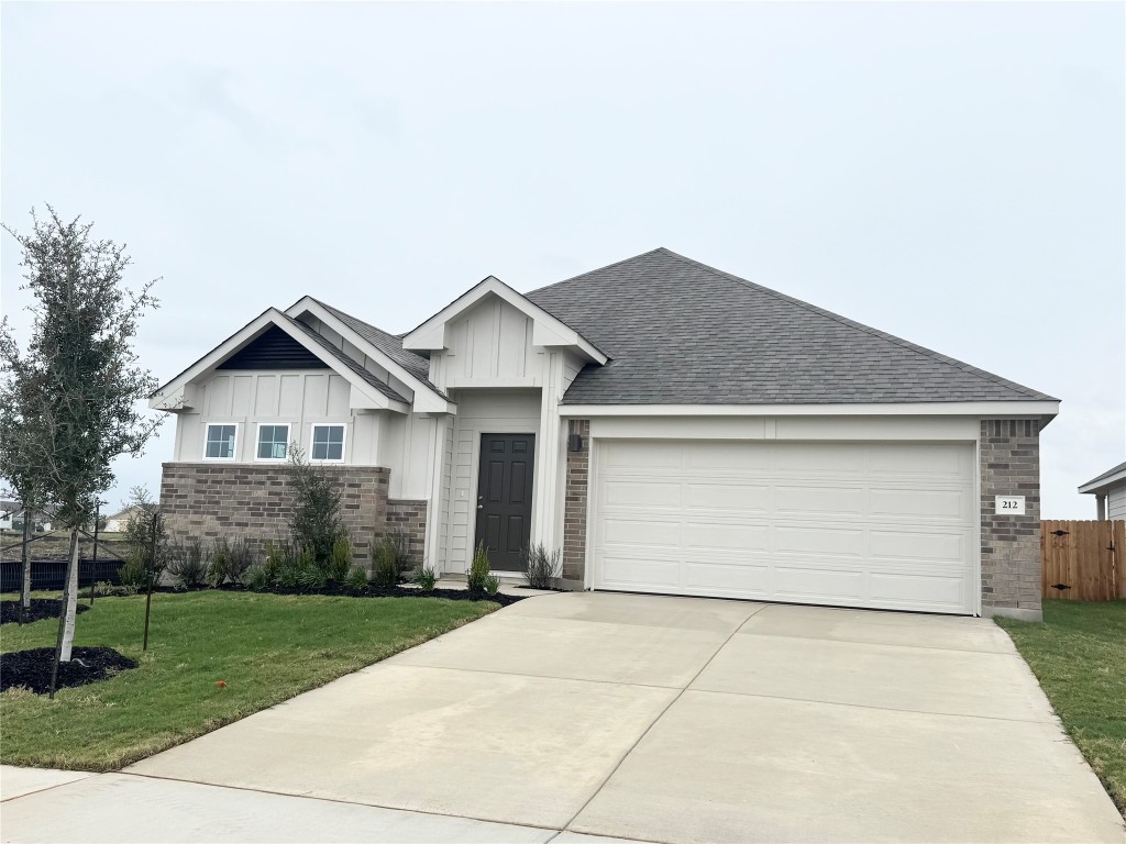 212 Hazy Vw Road San Marcos, TX 78666 - Photo 2 of 20 a front view of house with garage and yard