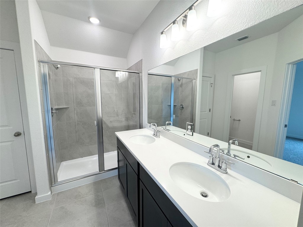 212 Hazy Vw Road San Marcos, TX 78666 - Photo 6 of 20 a bathroom with a sink double vanity and a mirror