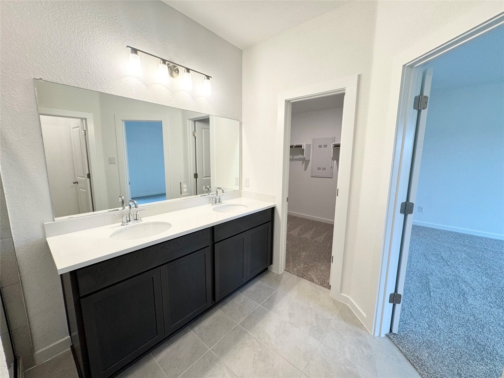 212 Hazy Vw Road San Marcos, TX 78666 - Photo 7 of 20 a bathroom with a double vanity sink mirror and double