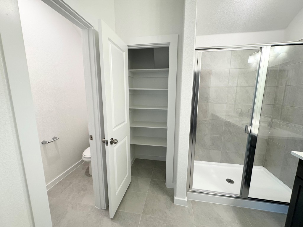 212 Hazy Vw Road San Marcos, TX 78666 - Photo 8 of 20 a bathroom with a glass door shower and a sink