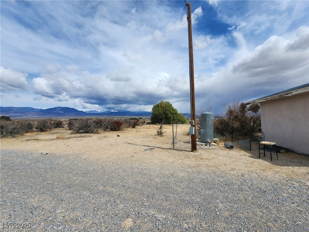 781 Buol Road Pahrump, NV 89048 - Photo 3 of 13 View of yard featuring a mountain view