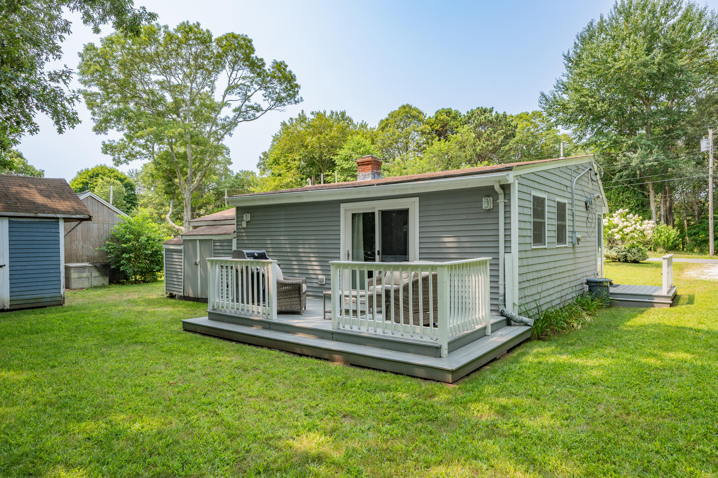 40 Red Lily Pond Road Centerville, MA 02632 - Photo 20 of 25 a view of a house with a yard and deck
