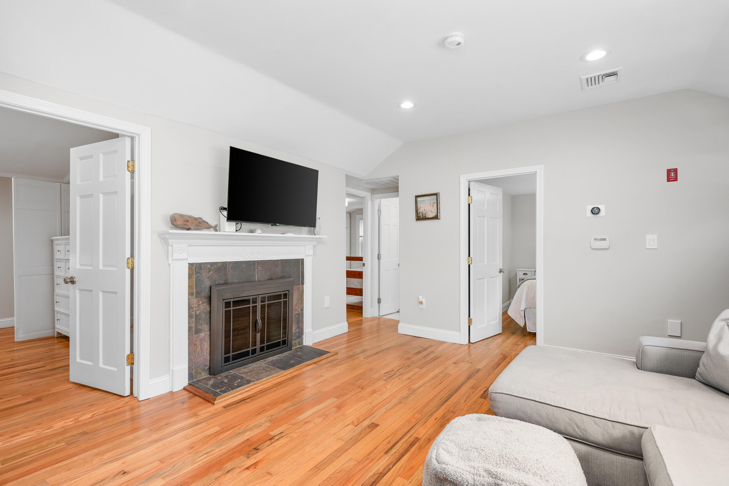 40 Red Lily Pond Road Centerville, MA 02632 - Photo 4 of 25 a bedroom with a bed and a fireplace