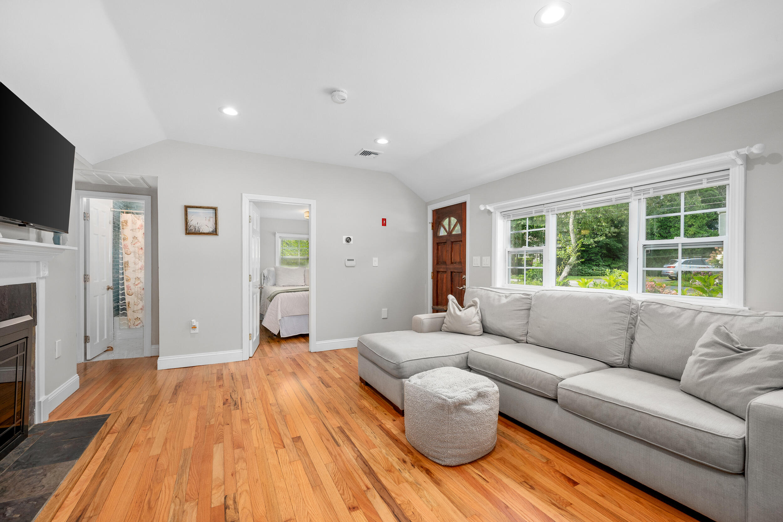 40 Red Lily Pond Road Centerville, MA 02632 - Photo 6 of 25 a living room with furniture and a flat screen tv