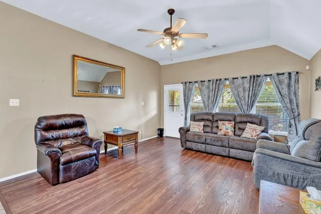 a living room with furniture and a large window