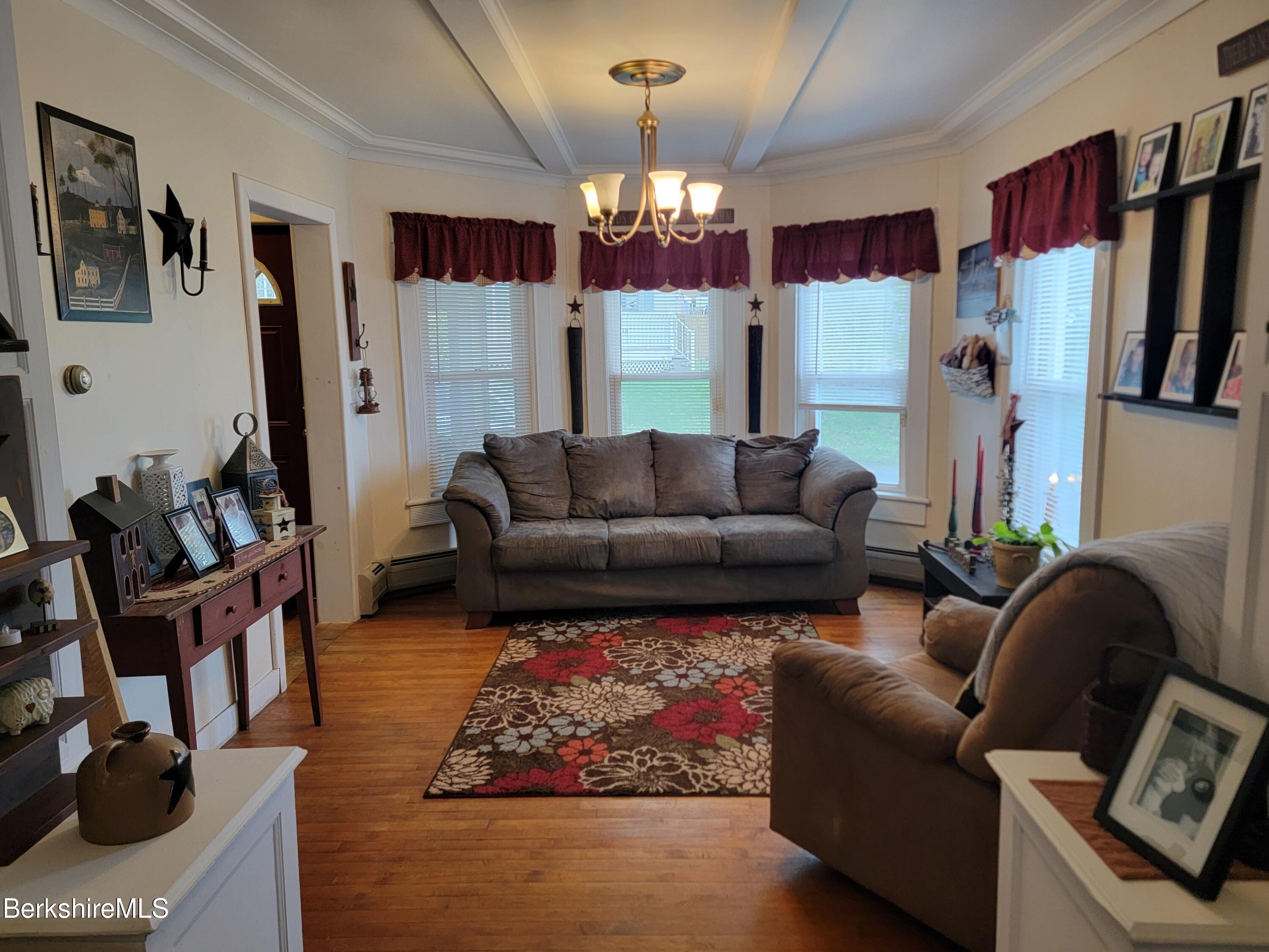 70 Frederick Street North Adams, MA 01247 - Photo 18 of 37 a living room with furniture and a chandelier