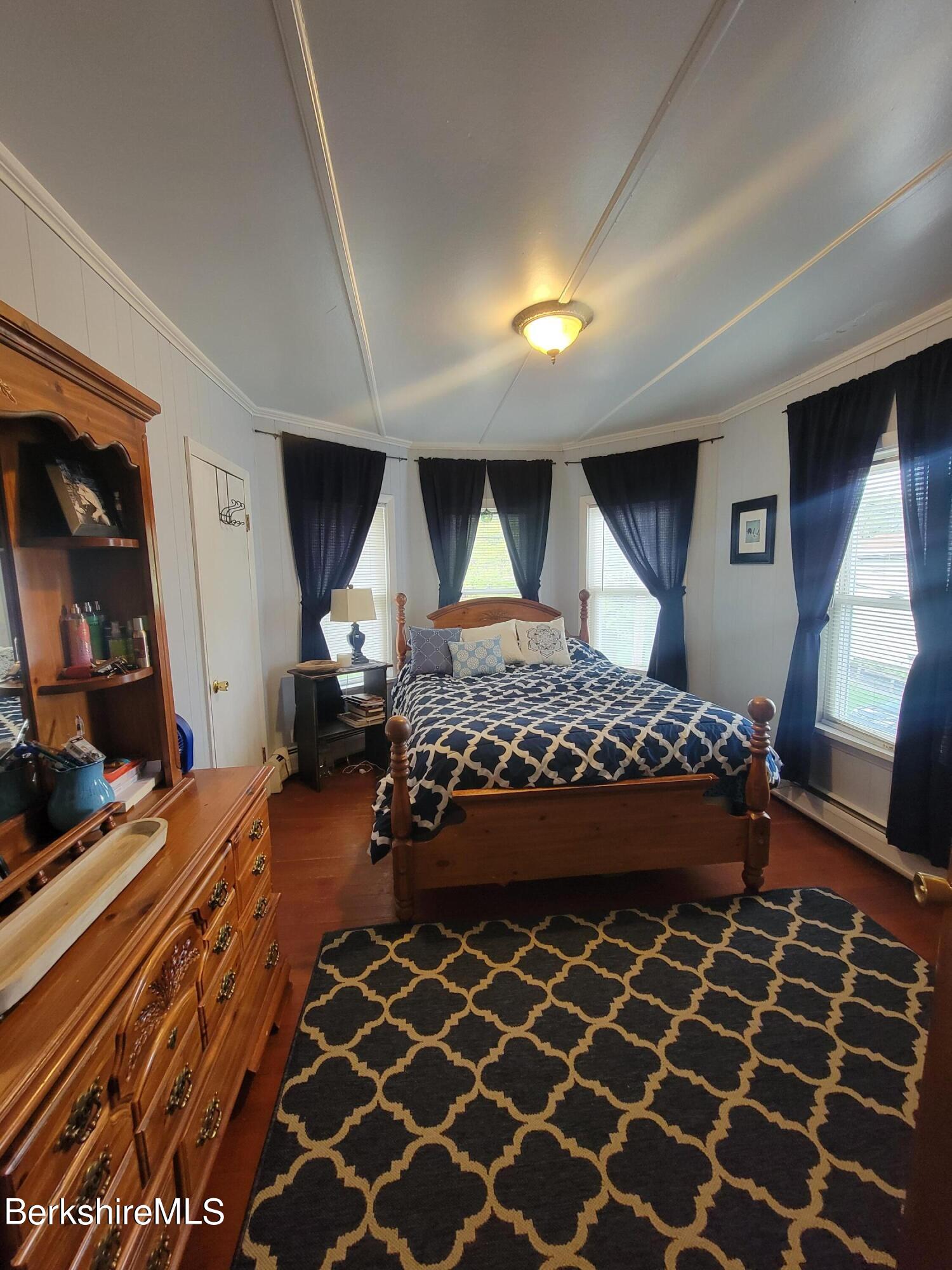 70 Frederick Street North Adams, MA 01247 - Photo 20 of 37 a bedroom with a bed and a mirror