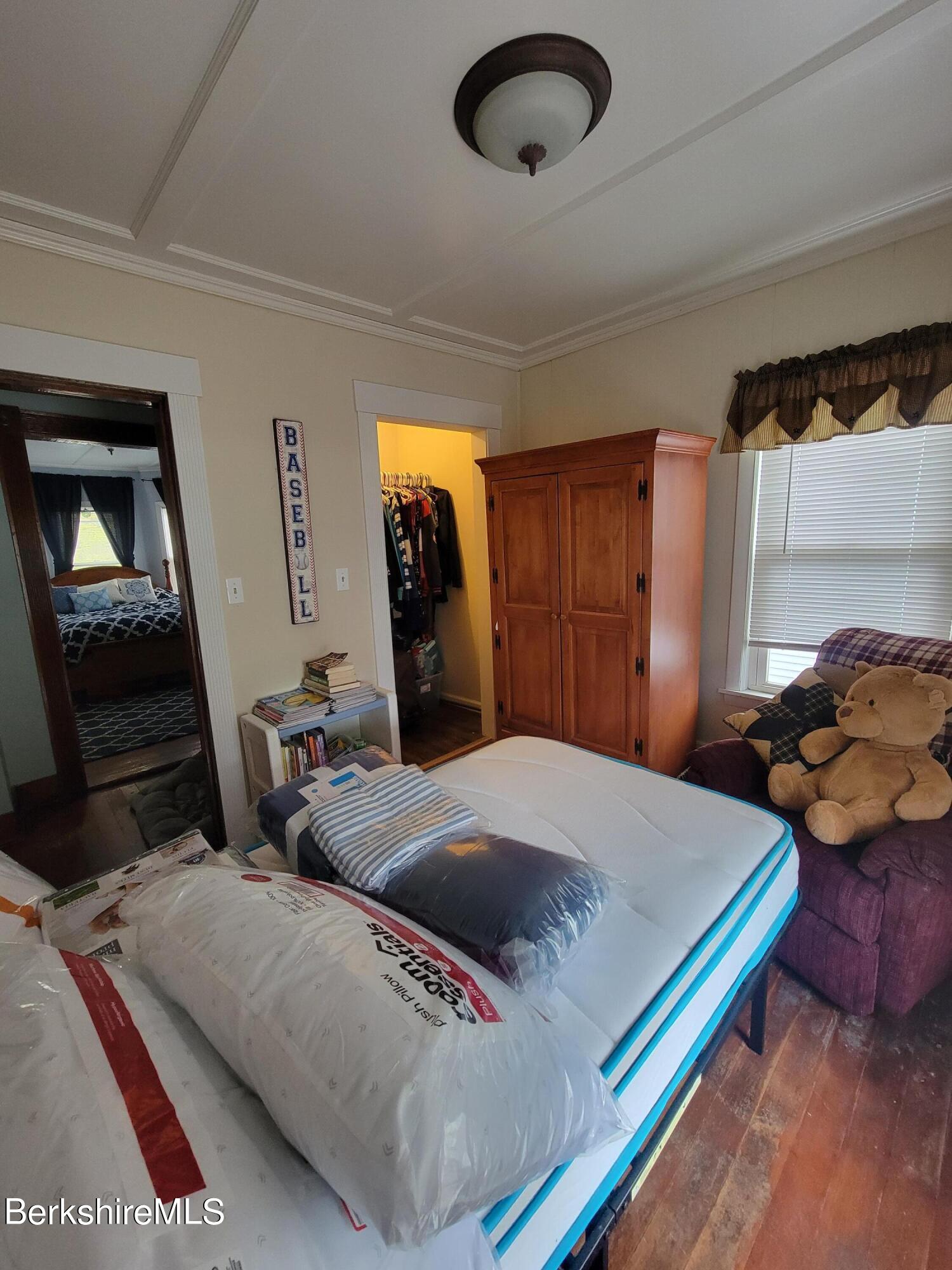 70 Frederick Street North Adams, MA 01247 - Photo 24 of 37 a bedroom with a bed and a television