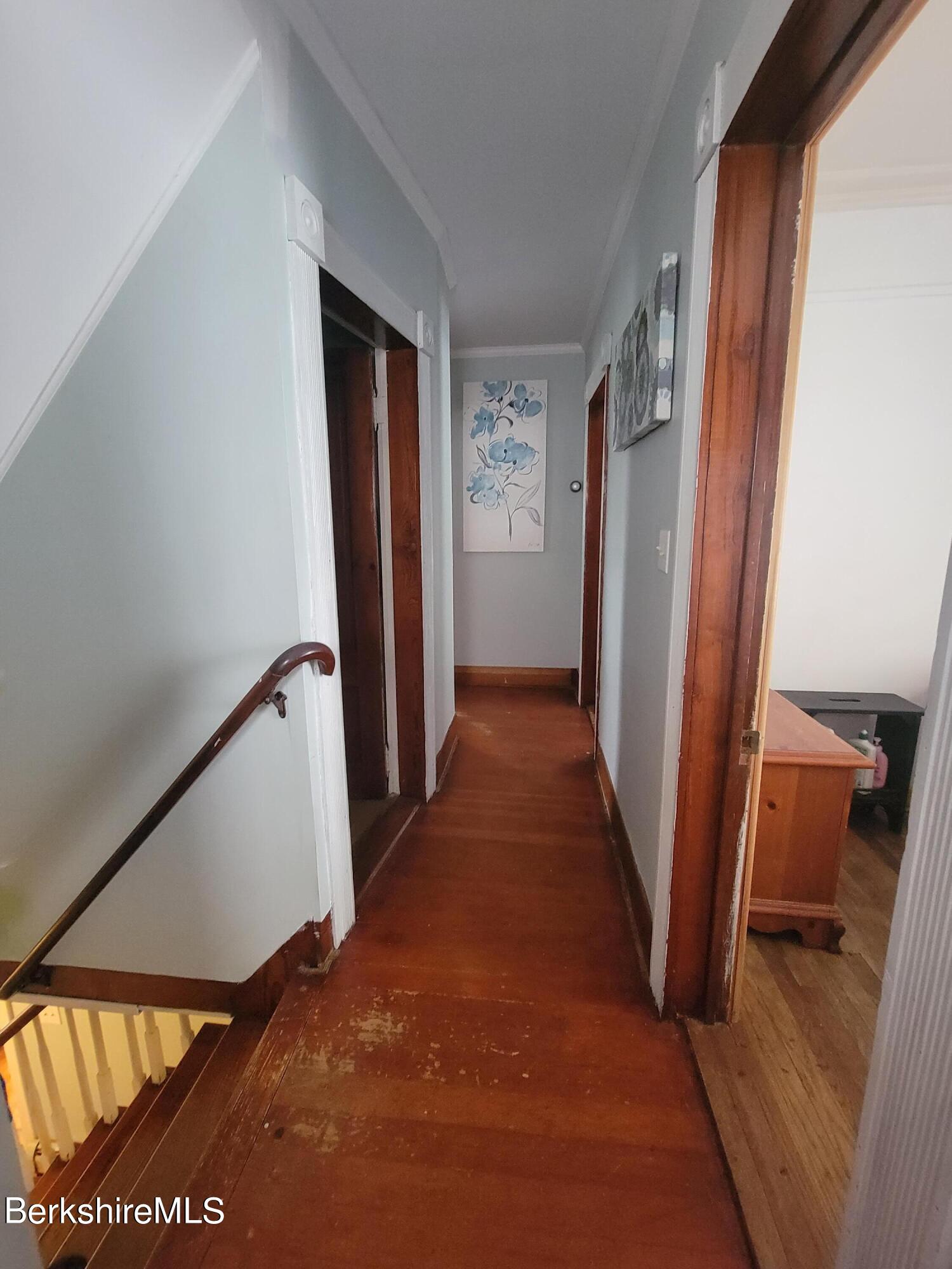 70 Frederick Street North Adams, MA 01247 - Photo 26 of 37 a view of a hallway with wooden floor and stairs