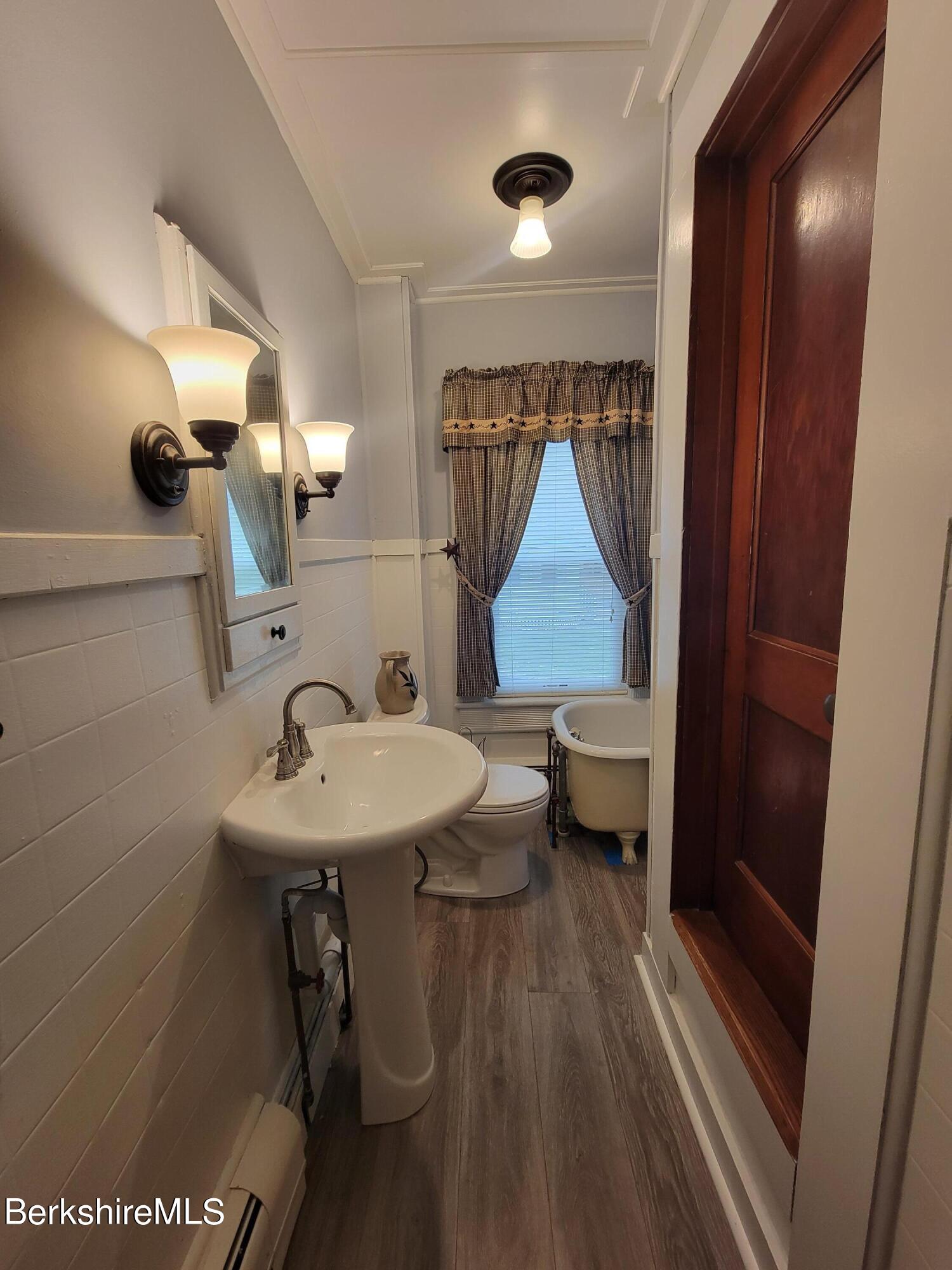 70 Frederick Street North Adams, MA 01247 - Photo 29 of 37 a bathroom with a sink toilet and shower