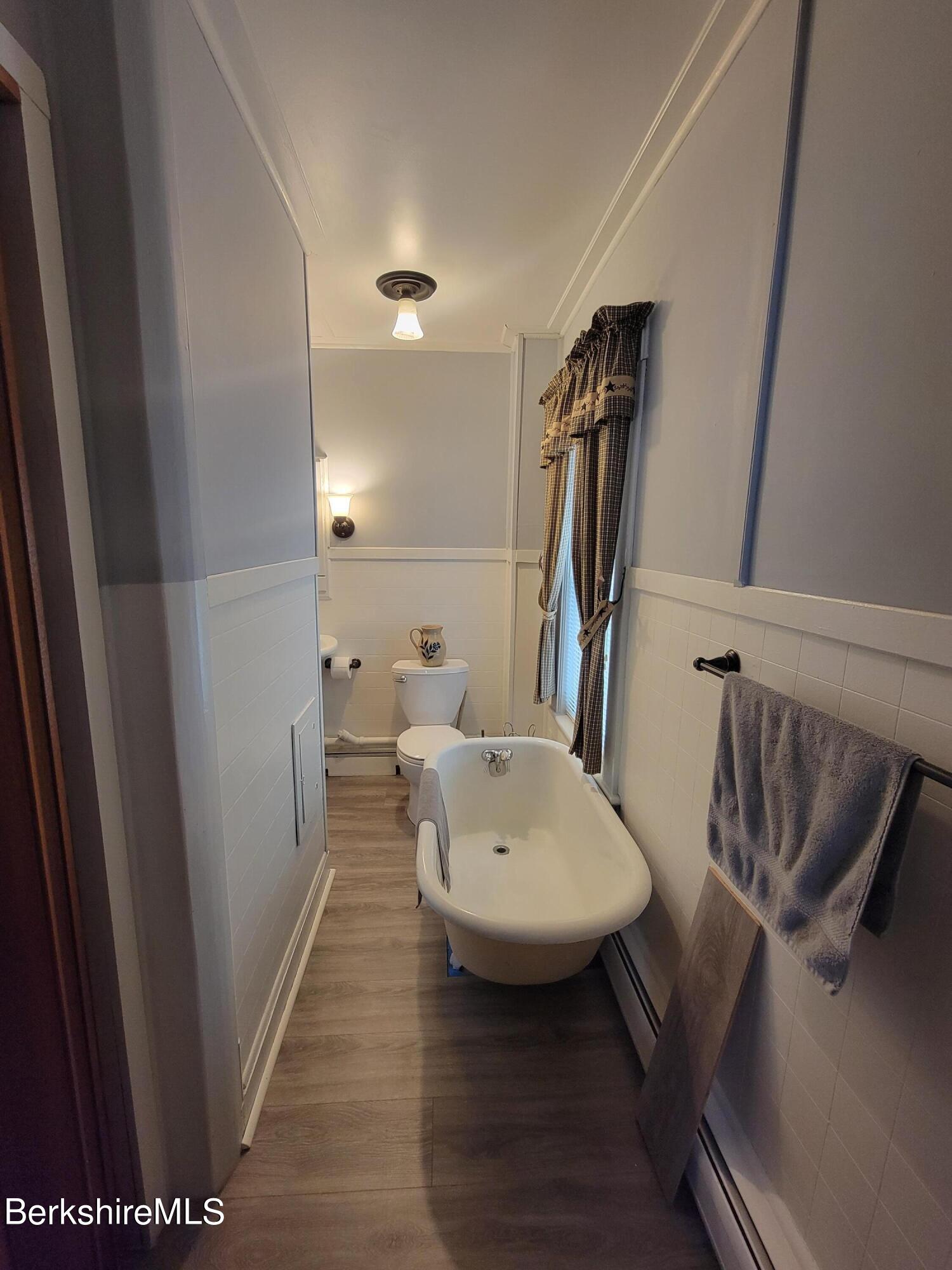 70 Frederick Street North Adams, MA 01247 - Photo 30 of 37 a bathroom with a sink a mirror and shower