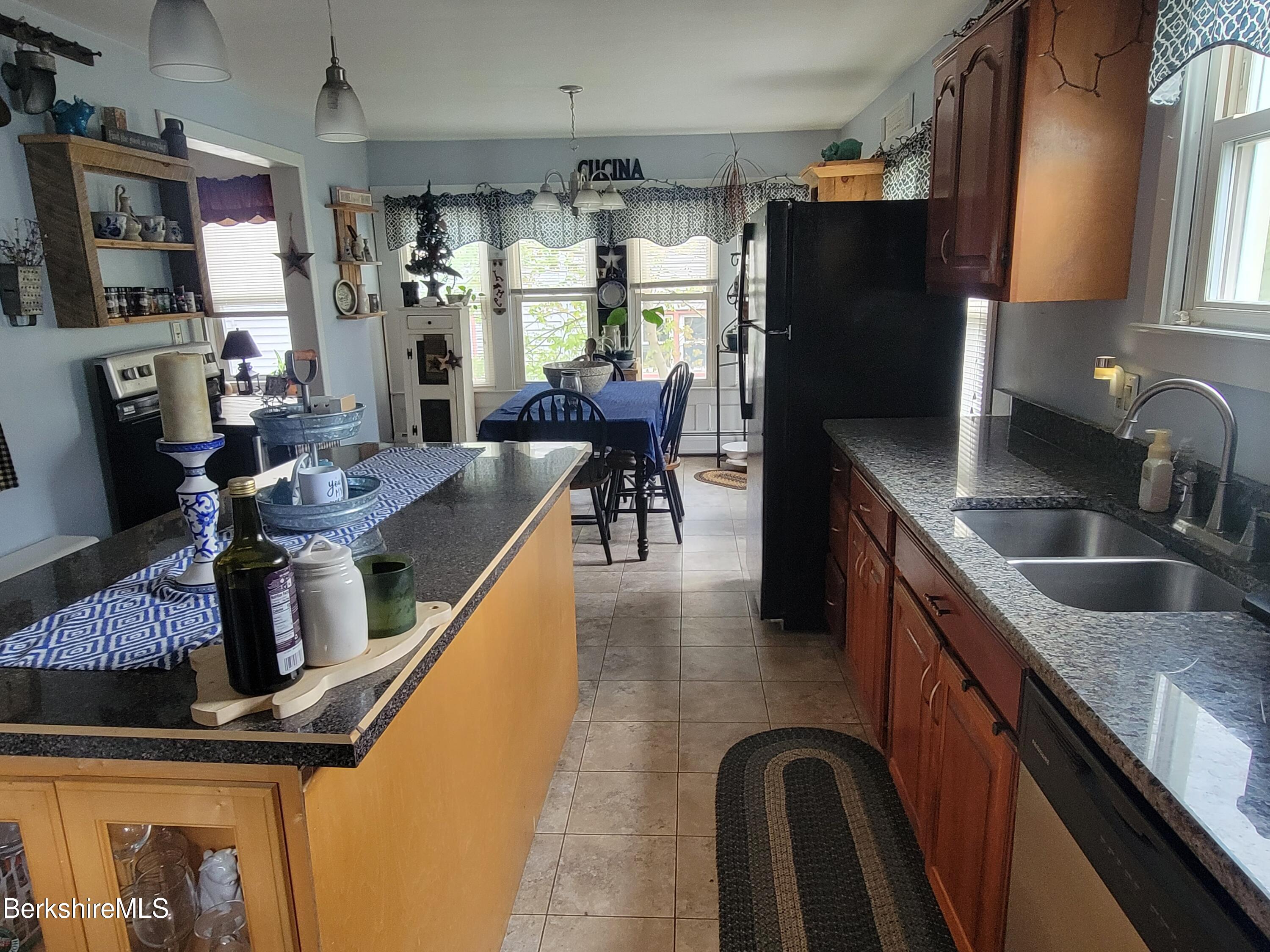 70 Frederick Street North Adams, MA 01247 - Photo 9 of 37 a kitchen with granite countertop lots of counter top space and stainless steel appliances