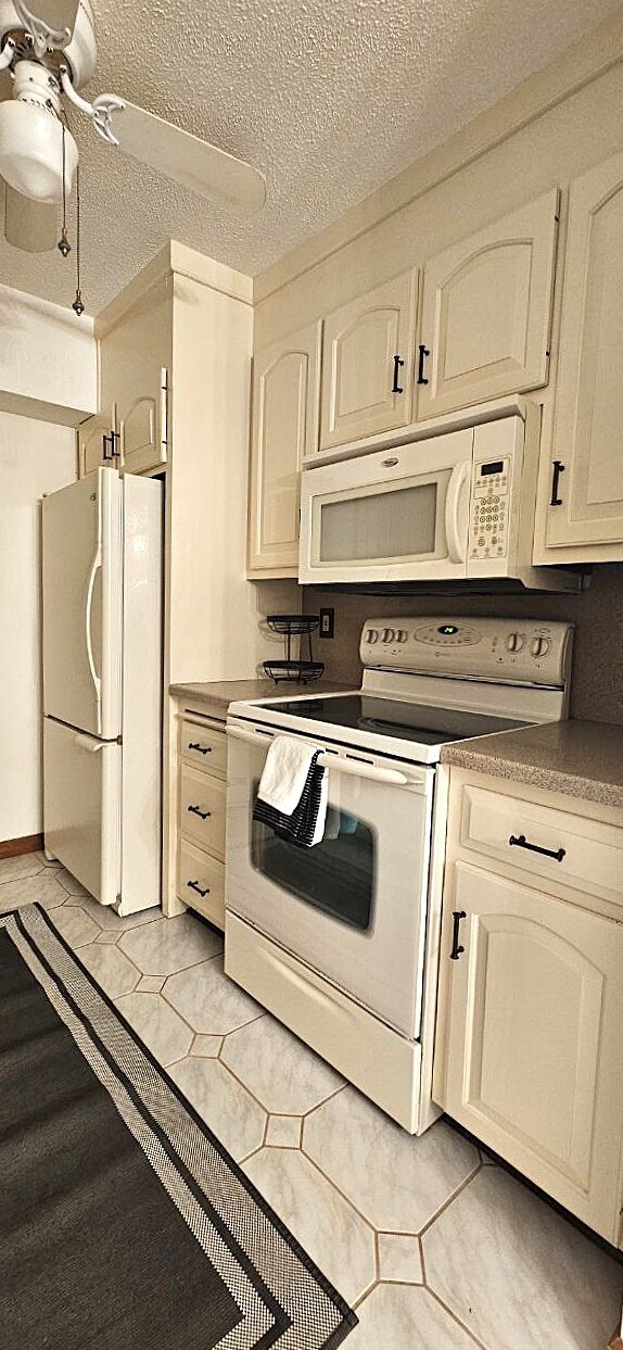 25 Washington Street, Unit 22 Bristol, CT 06010 - Photo 13 of 40 a kitchen with white cabinets and white appliances