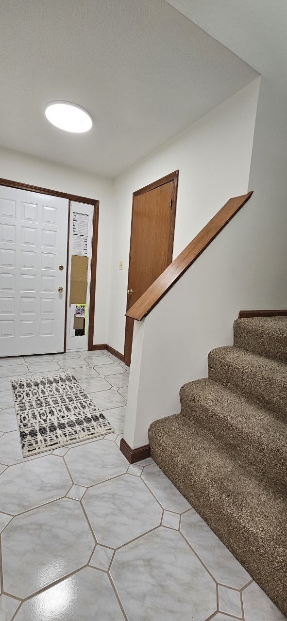 25 Washington Street, Unit 22 Bristol, CT 06010 - Photo 16 of 40 a bedroom with a bed and wooden floor