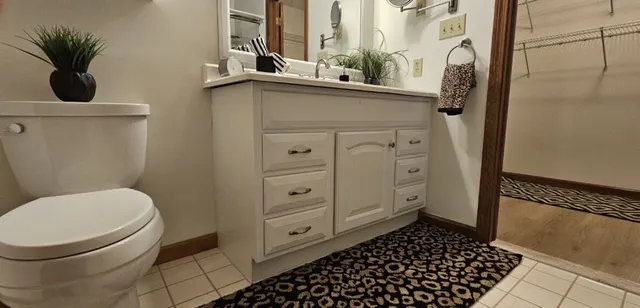 a bathroom with a toilet and a sink