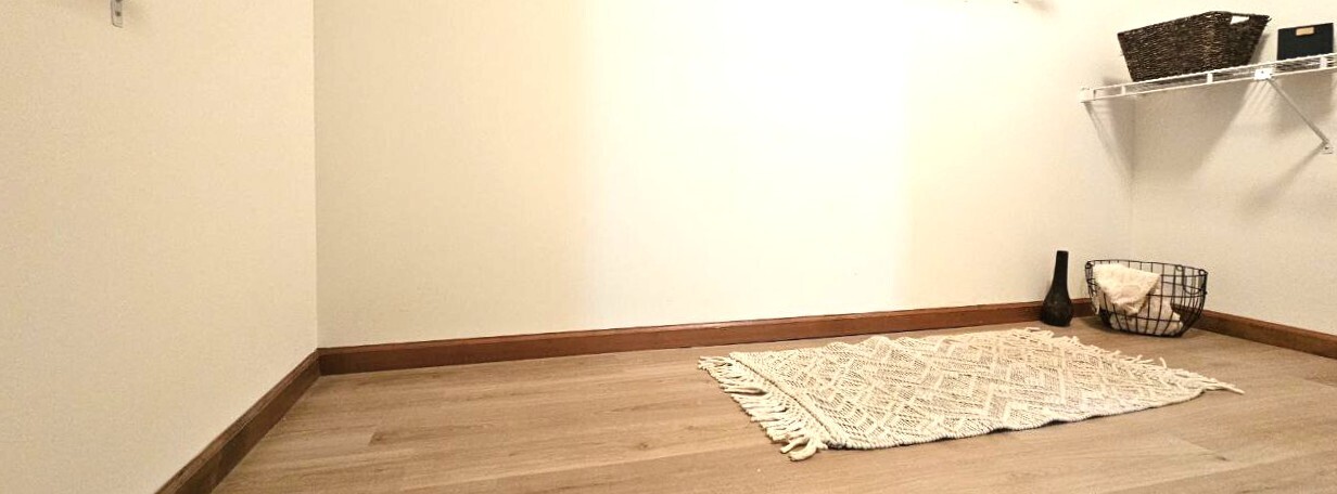 25 Washington Street, Unit 22 Bristol, CT 06010 - Photo 34 of 40 a view of empty room with wooden floor and fan