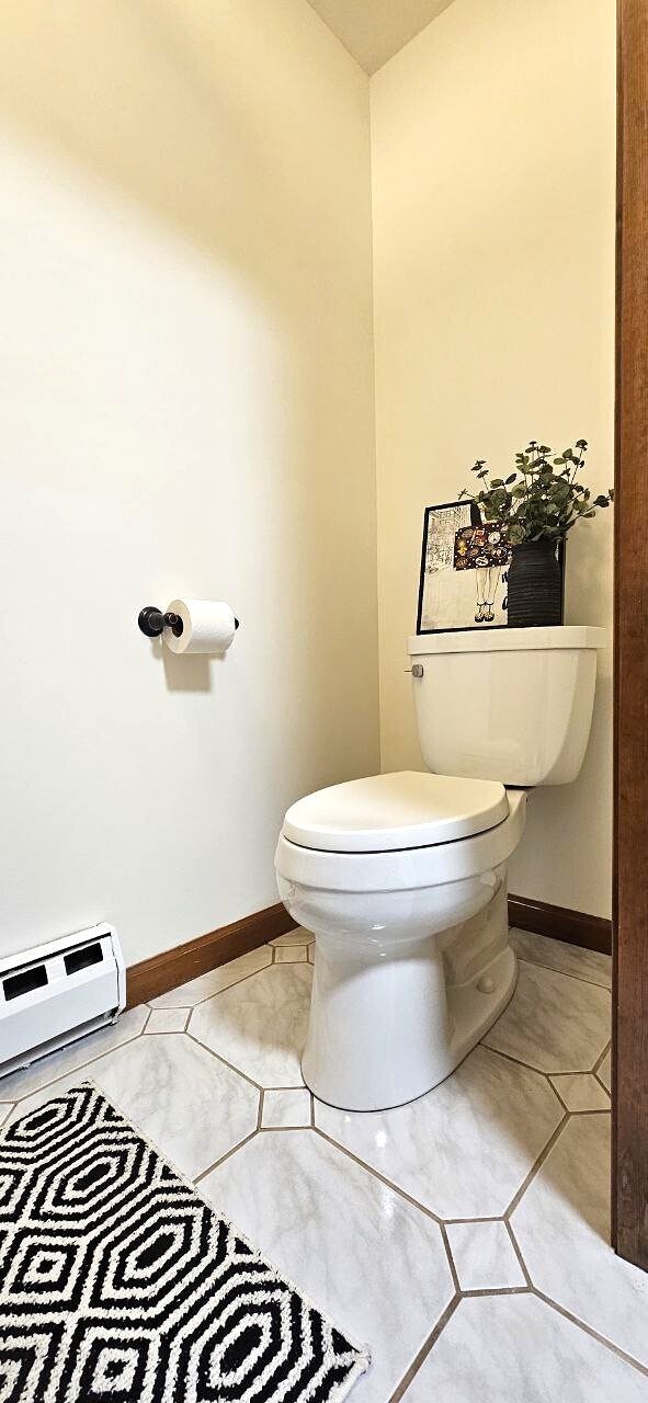 25 Washington Street, Unit 22 Bristol, CT 06010 - Photo 4 of 40 a bathroom with a toilet and a shower