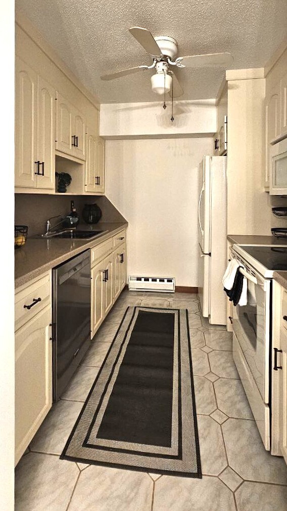 25 Washington Street, Unit 22 Bristol, CT 06010 - Photo 10 of 40 a kitchen with stainless steel appliances granite countertop a stove a sink and a refrigerator