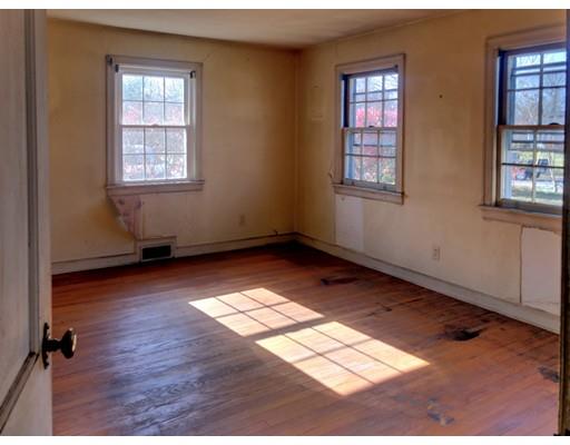 959 Bradley Road Springfield, MA 01109 - Photo 7 of 15 an empty room with wooden floor and windows