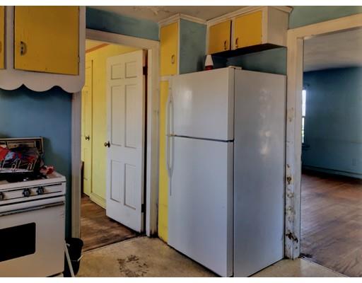 959 Bradley Road Springfield, MA 01109 - Photo 10 of 15 a white refrigerator freezer and a stove sitting inside of a kitchen