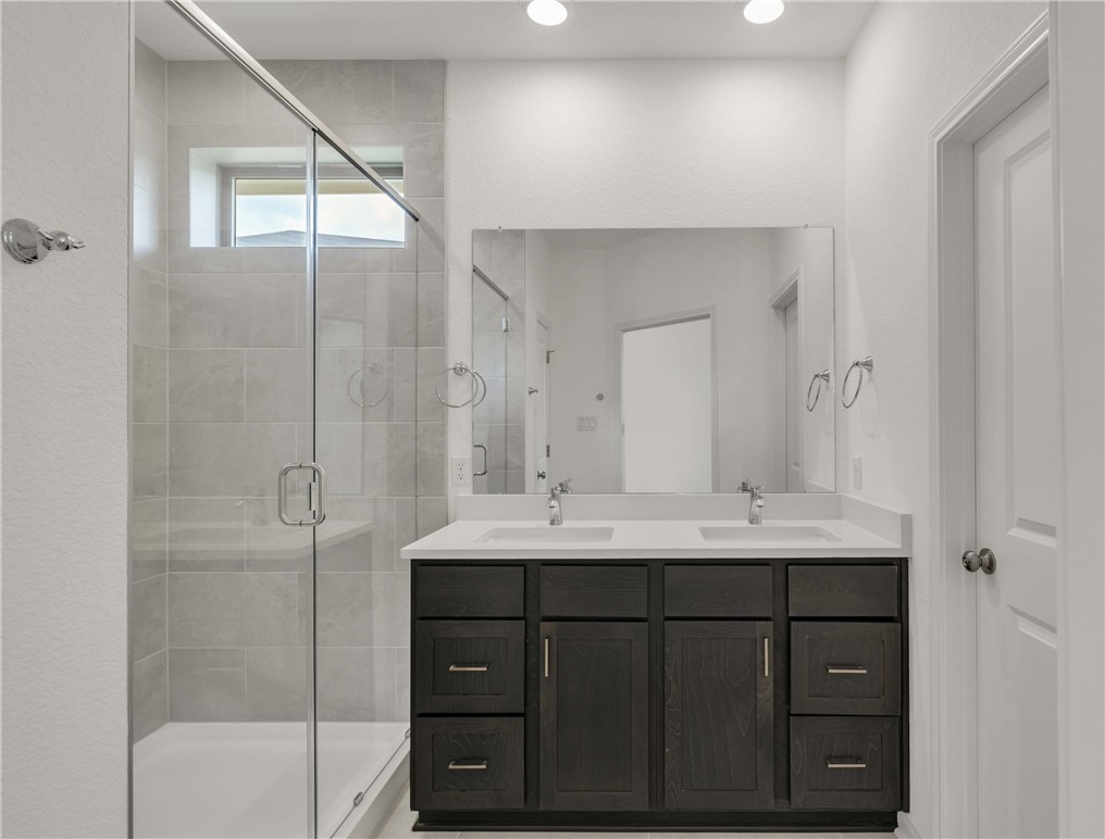 2776 Messenger Way Bryan, TX 77803 - Photo 13 of 16 a bathroom with a sink double vanity and a shower