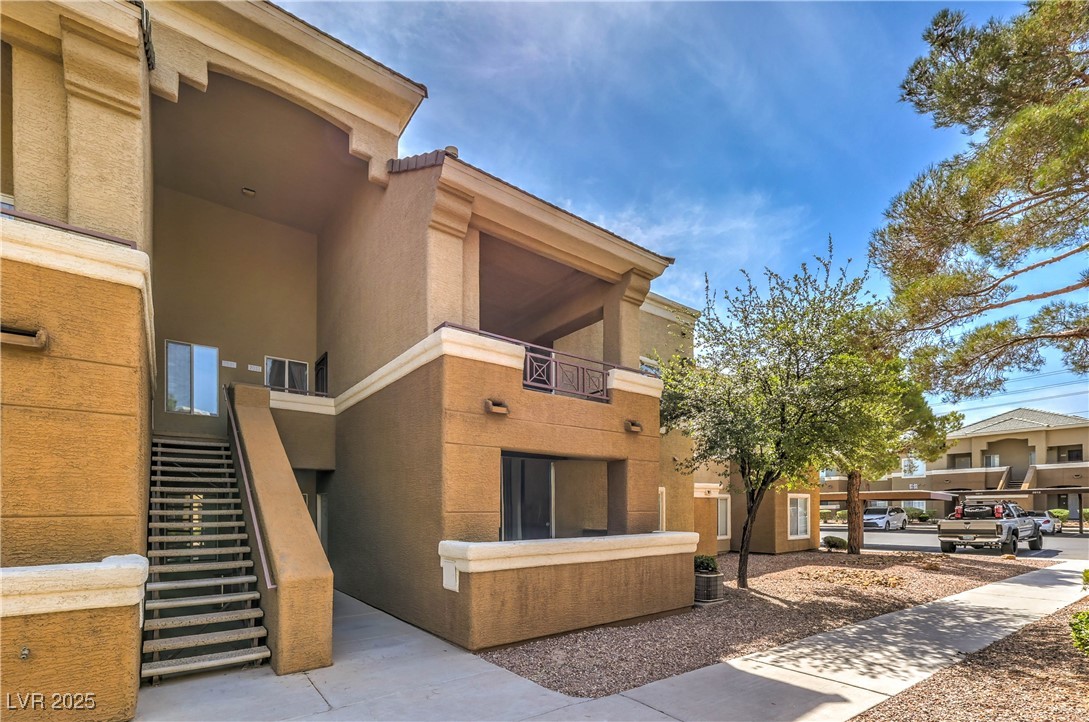 8070 West Russell Road, Unit 2032 Las Vegas, NV 89113 - Photo 3 of 29 View of building exterior with stairs