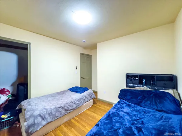 a bedroom with a bed and a tv