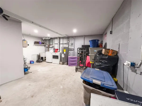 a view of parking garage with cars and other equipment