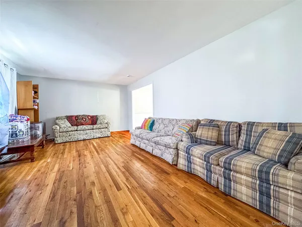 a living room with a bed and a couch