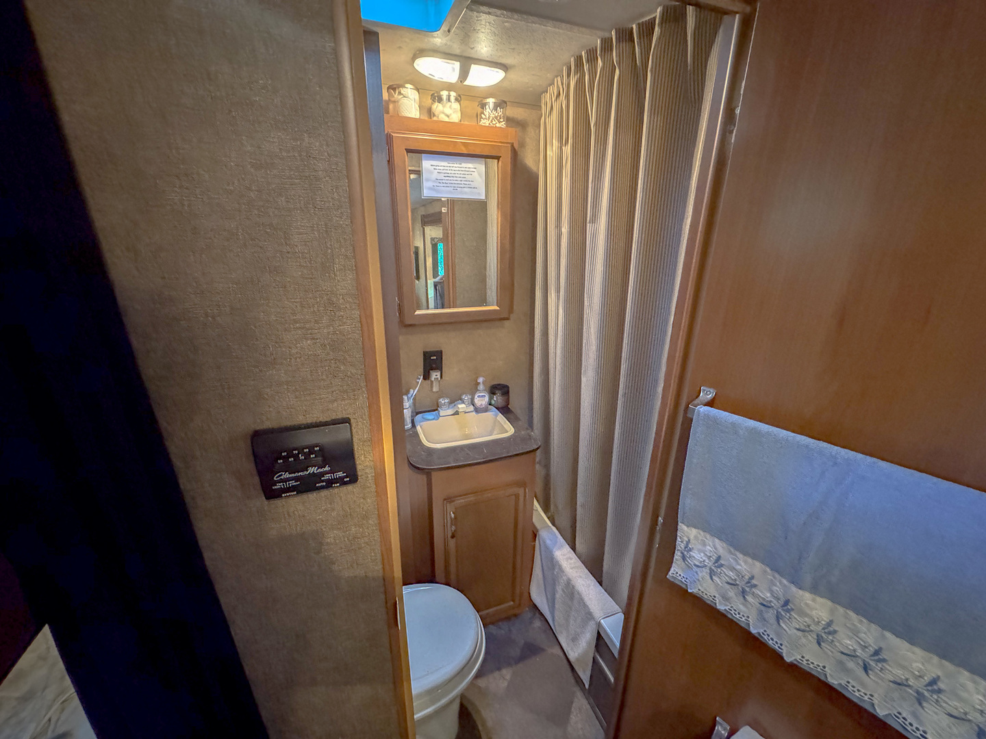 9-46 Woodhaven Sublette, IL 61367 - Photo 17 of 18 a bathroom with a sink a toilet a mirror and vanity
