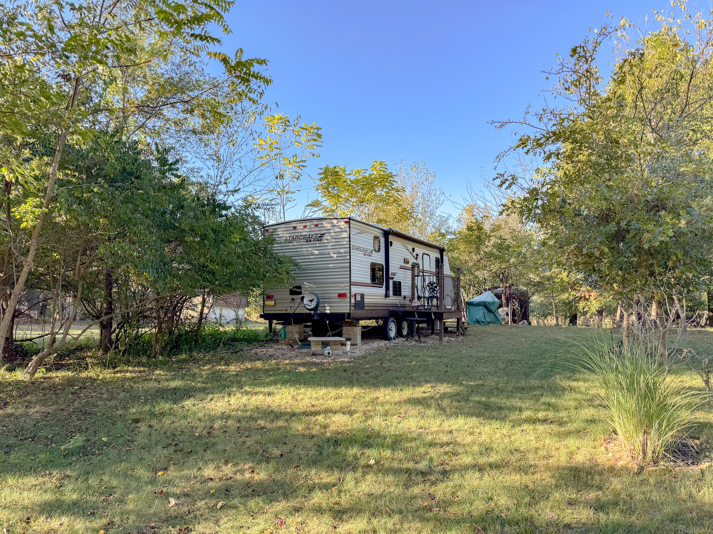9-46 Woodhaven Sublette, IL 61367 - Photo 2 of 18 a view of a house with a yard patio and fire pit