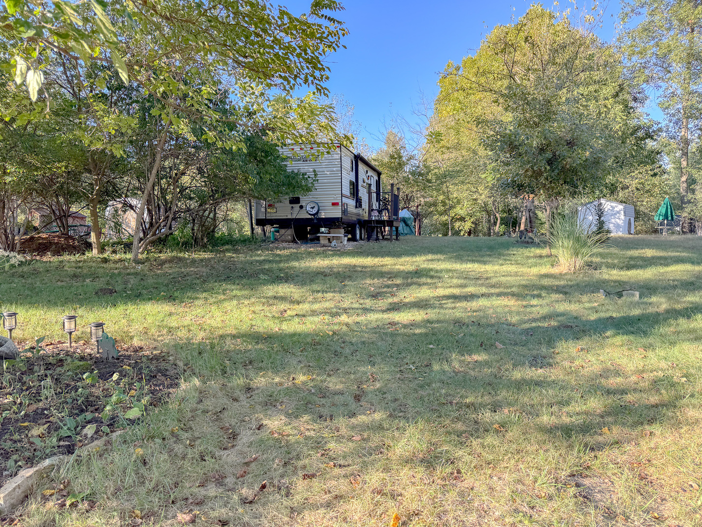 9-46 Woodhaven Sublette, IL 61367 - Photo 3 of 18 a swimming pool with outdoor seating and yard